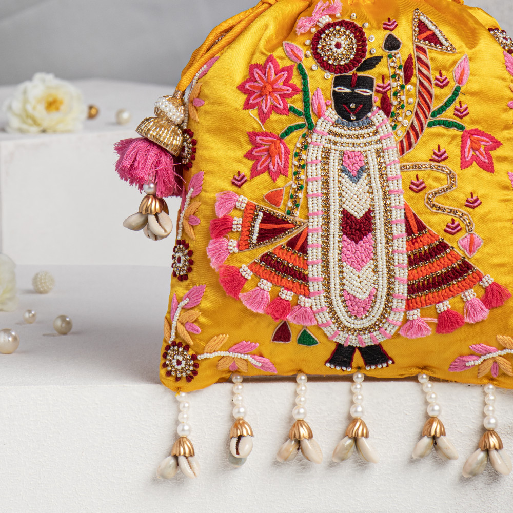 Image of Shree Nath Ji Yellow Satin Silk Potli Bag with Tassel Embellishment
