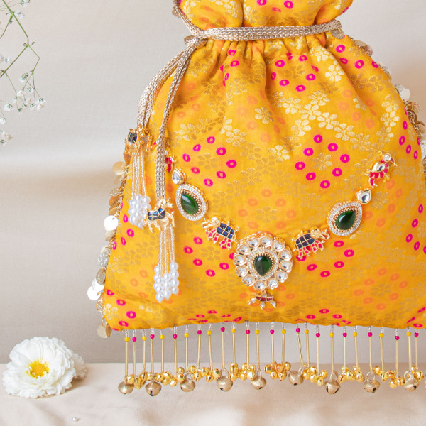 Royal Mustard Banarasi Brocade Potli with Elephant Motif Jewel Brooch