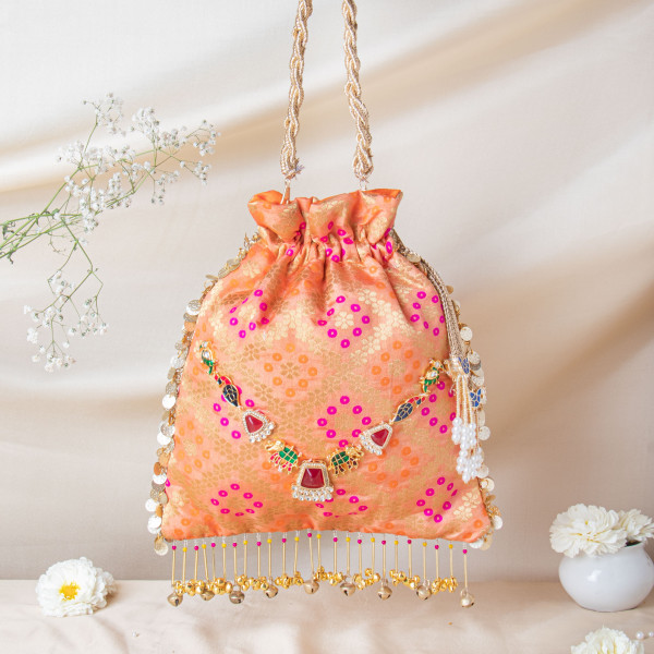 Royal Peach Banarasi Brocade Potli with Ruby-Meenakari Heritage Detailing