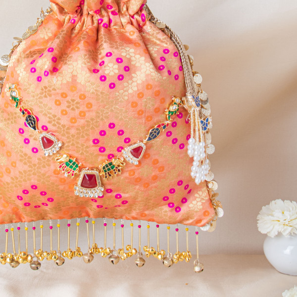 Royal Peach Banarasi Brocade Potli with Ruby-Meenakari Heritage Detailing