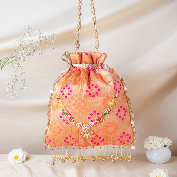 Royal Peach Banarasi Brocade Potli with Ruby-Meenakari Heritage Detailing