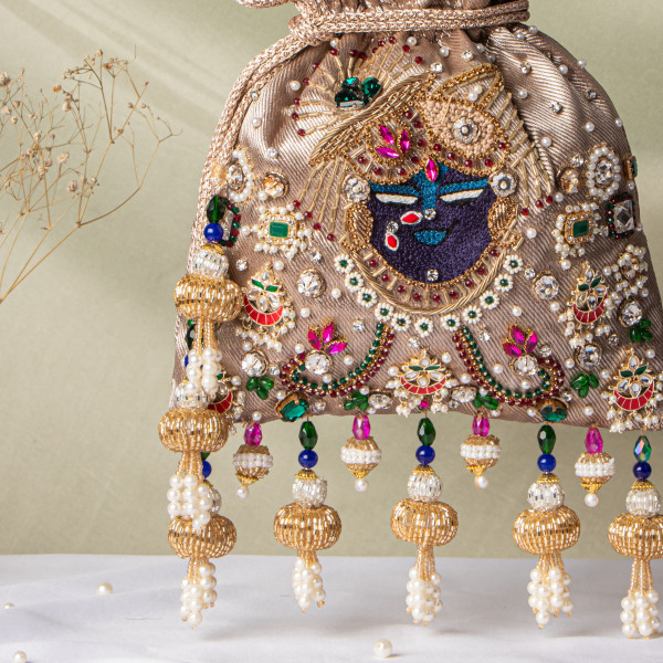 Jewellery Shrinathji Tissue Potli – Light Copper Gold | Regal Hand-Embroidered Potli Bag