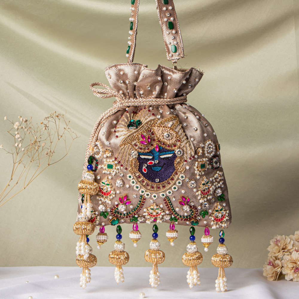 Image of Jewellery Shrinathji Tissue Potli – Light Copper Gold | Regal Hand-Embroidered Potli Bag