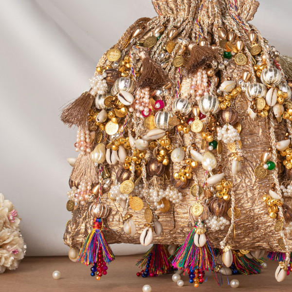 Iconic Antique Gold Crushed Tissue Potli Bag with Embellished Fringes