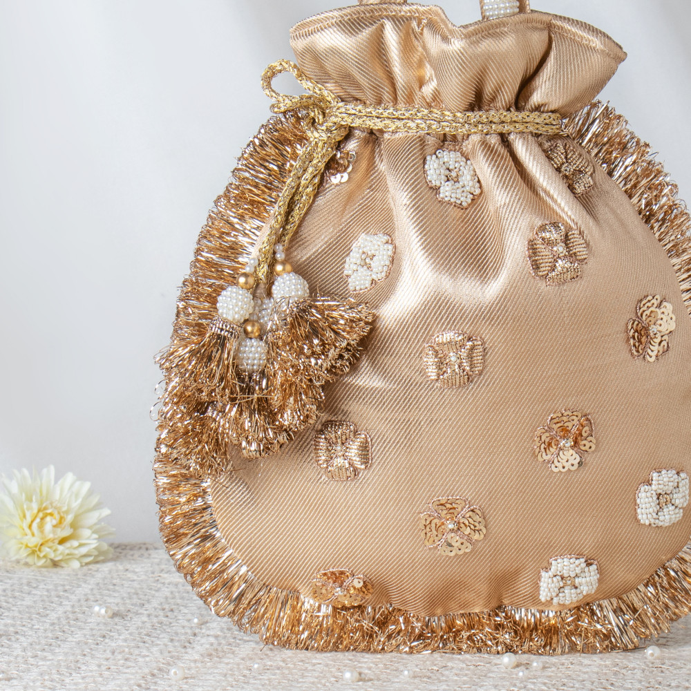Image of Golden Tissue Zari Potli Bag | Shimmering Wedding Pouch