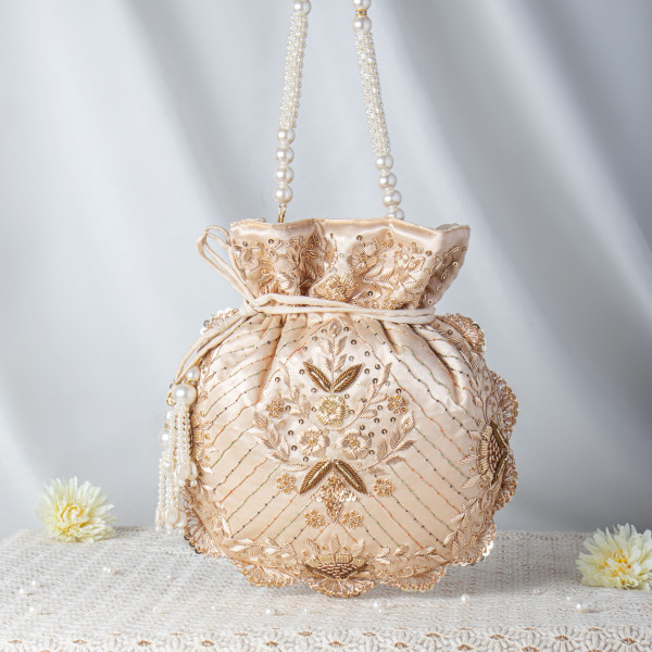 Luminous Beige Satin Potli Bag with Pearl String Handle and Floral Embroidery ??