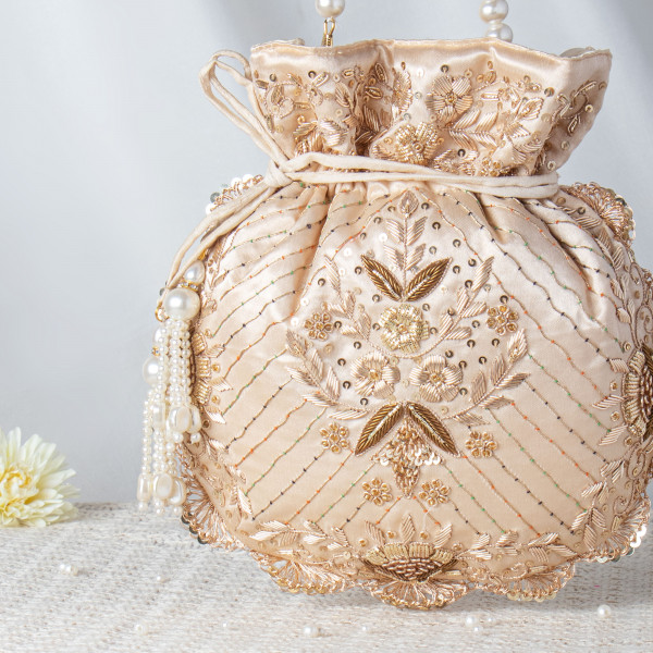 Luminous Beige Satin Potli Bag with Pearl String Handle and Floral Embroidery ??