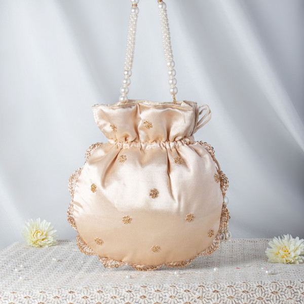 Luminous Beige Satin Potli Bag with Pearl String Handle and Floral Embroidery ??