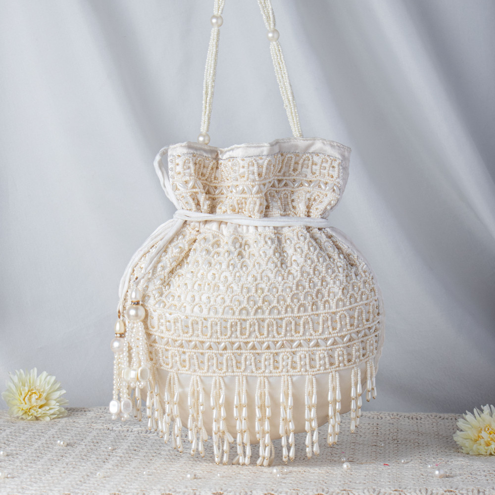 Image of Handcrafted Off-White Pearl Potli Bag – Luxury Beaded Bridal Batua with Waterfall Fringe