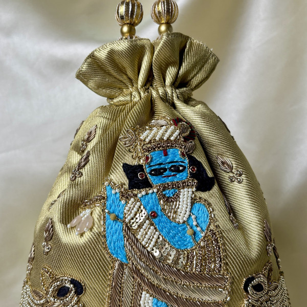 Golden Tissue Hand-Embroidered Krishna Cow Potli Bag – Zardozi & Sequin Festive Wedding Potli