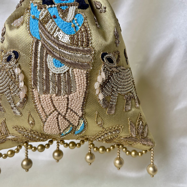 Golden Tissue Hand-Embroidered Krishna Cow Potli Bag – Zardozi & Sequin Festive Wedding Potli