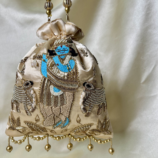 Light Beige Satin Silk Hand-Embroidered Krishna Cow Motif Potli Bag – Festive Wedding Gifting Bag