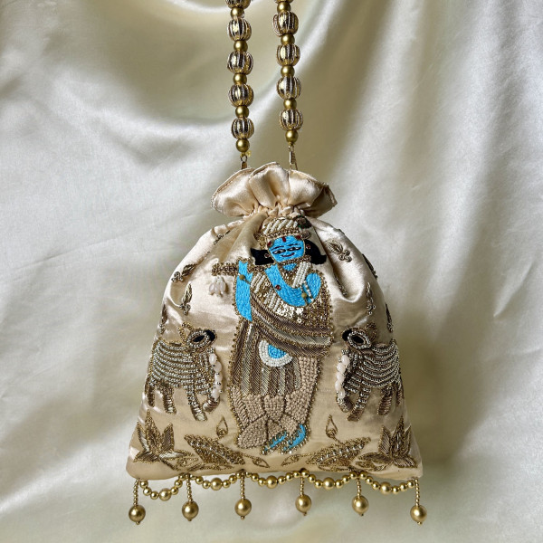 Light Beige Satin Silk Hand-Embroidered Krishna Cow Motif Potli Bag – Festive Wedding Gifting Bag