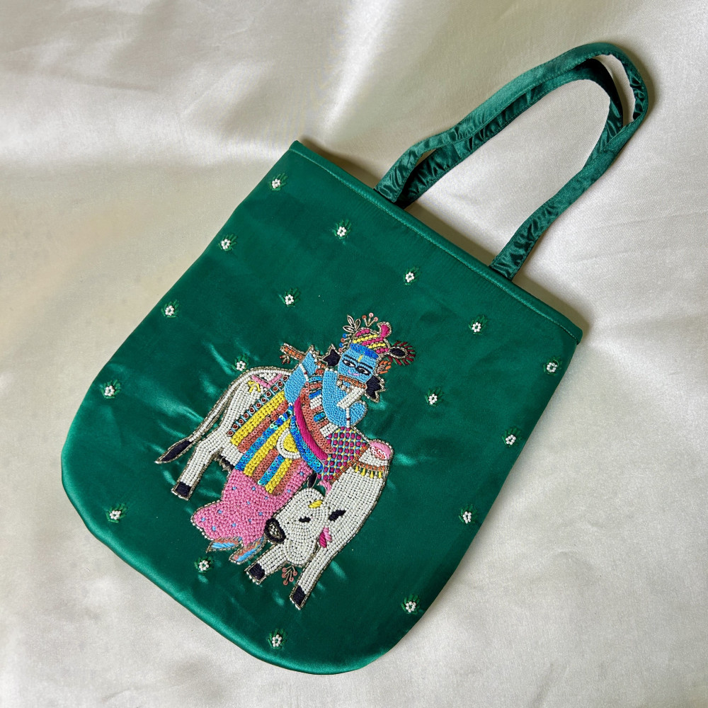 Image of Dark Green Hand-Embroidered Krishna with Cow Satin Silk Handbag – Traditional Festive Bag