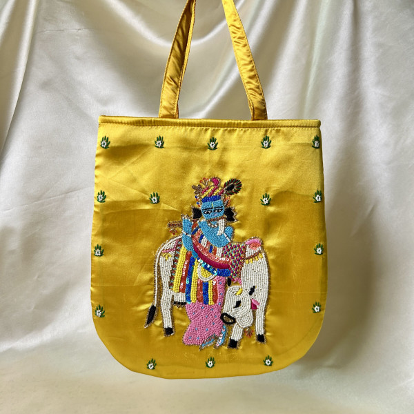 Bright Yellow Hand-Embroidered Krishna with Cow Satin Silk Handbag – Traditional Festive Bag