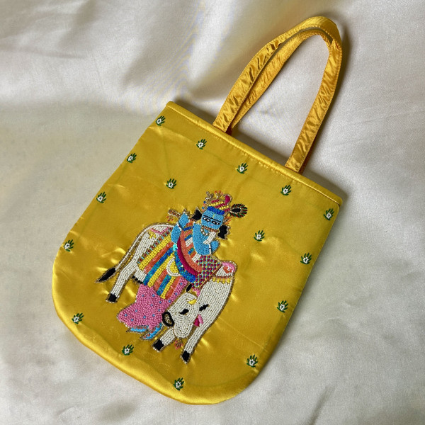 Bright Yellow Hand-Embroidered Krishna with Cow Satin Silk Handbag – Traditional Festive Bag