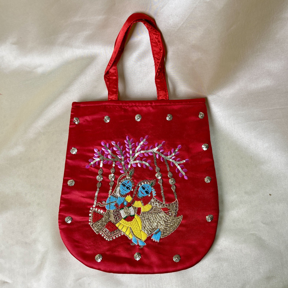 Image of Red Hand-Embroidered Radha-Krishna Satin Silk Handbag with French Knot Detailing