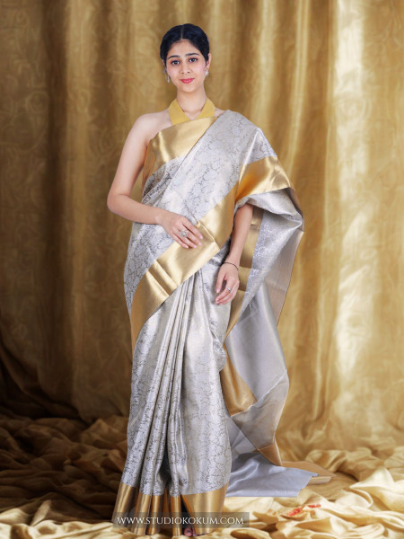 Image of Navya: Golden Silver Tissue Silk Saree