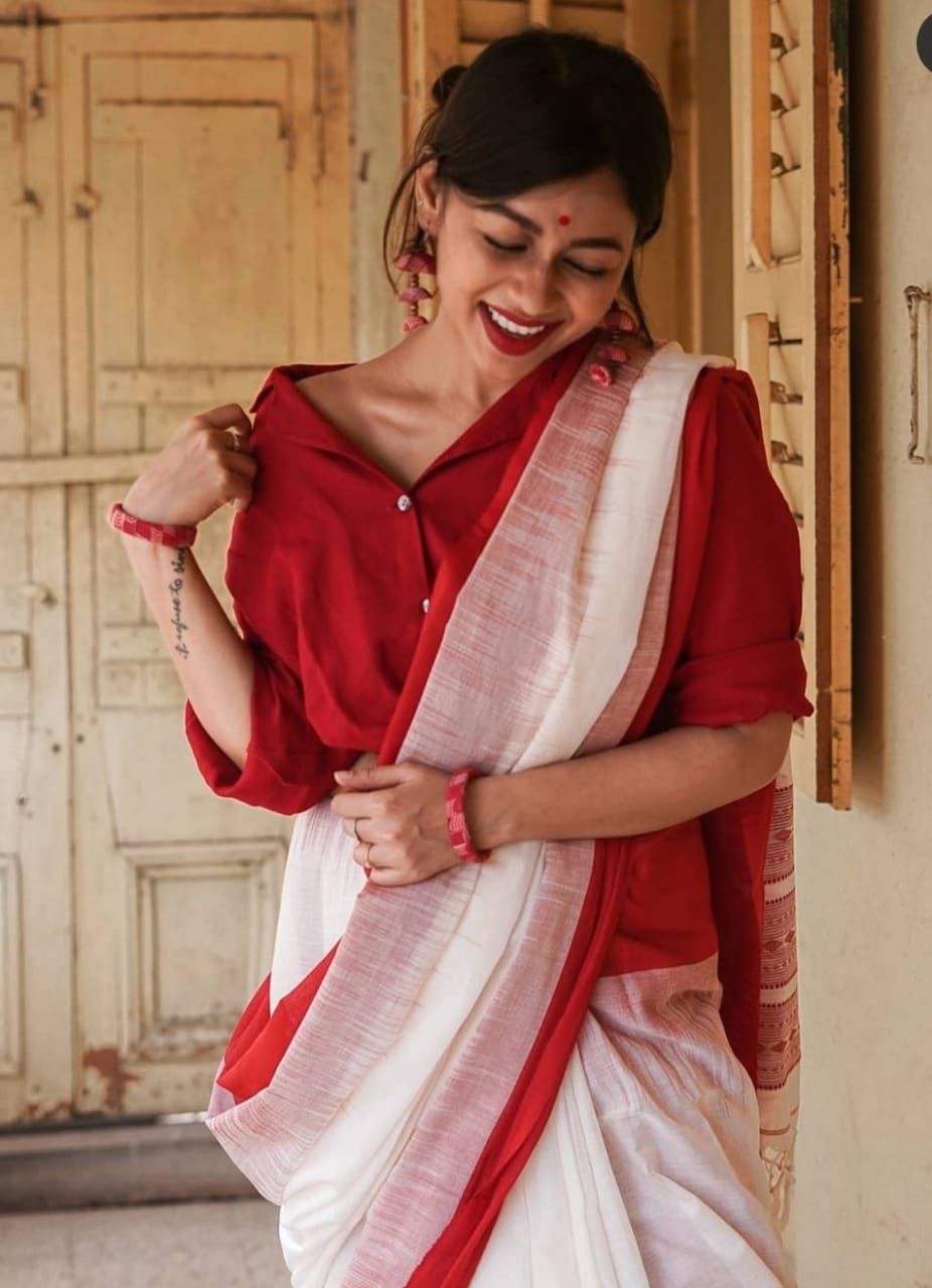 Pure Linen Resham Weaved Saree With Red Border And Tassels