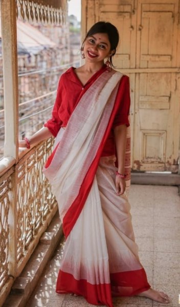 Image of Pure Linen Resham Weaved Saree With Red Border And Tassels
