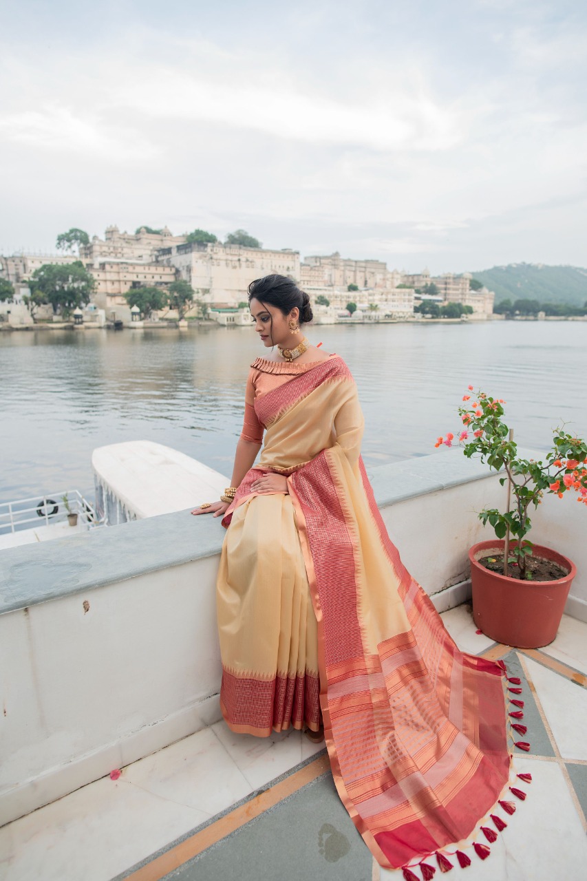 Cream Tissue Silk Saree With Rich Zari Pallu And Border
