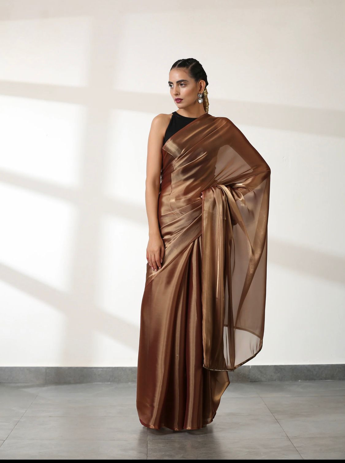 Metallic Polish Silk All Over Plain Saree With Latkans On Pallu