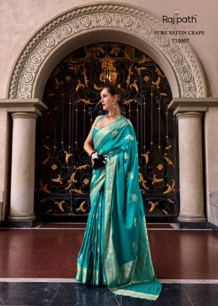 Image of Teal Pure Banarasi Satin Crape Silk Rich Zari Weaved Pallu Saree