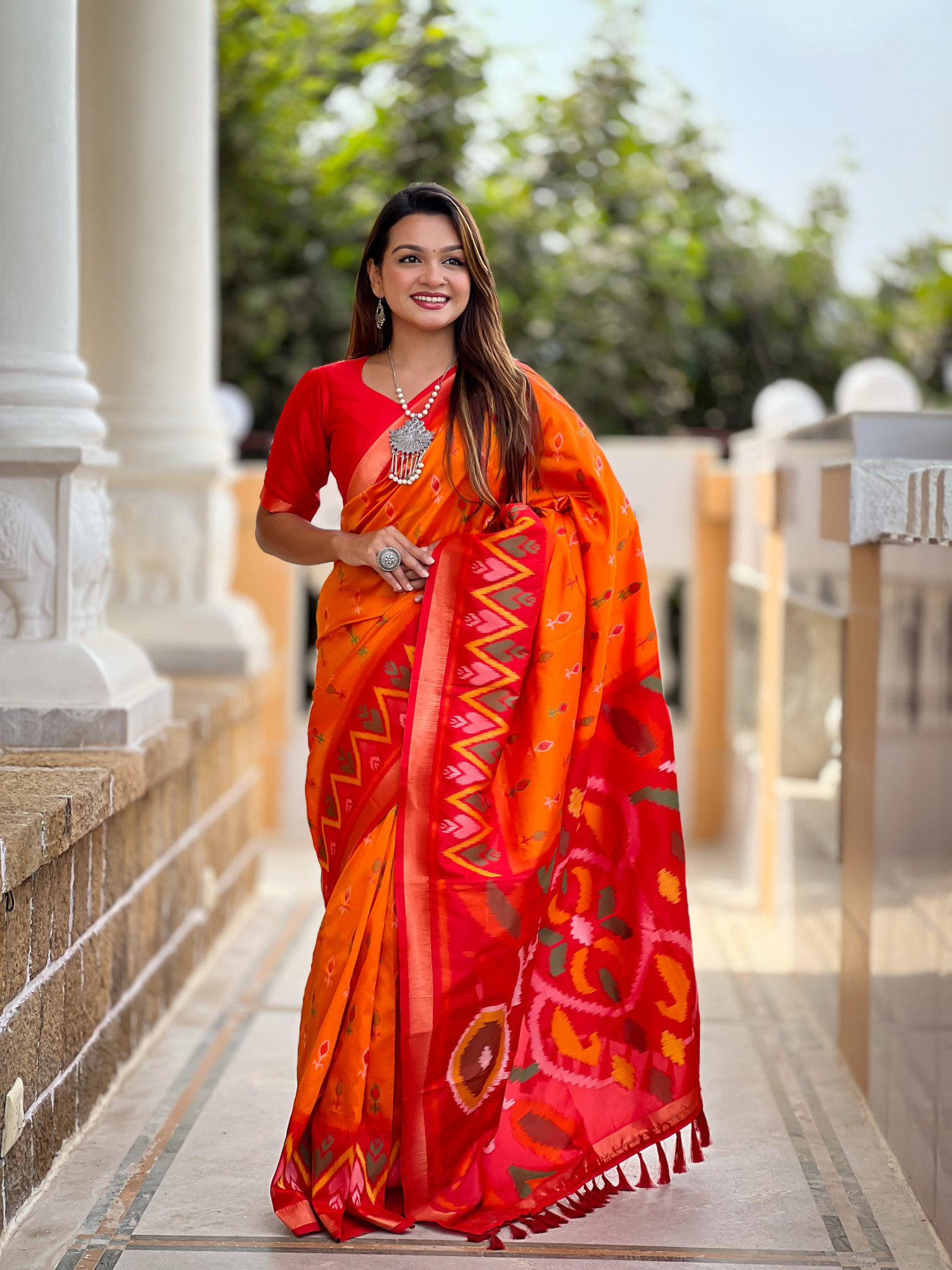 Orange Soft Silk Ikkat And Patola Concept Weaved Contrast Pallu Saree