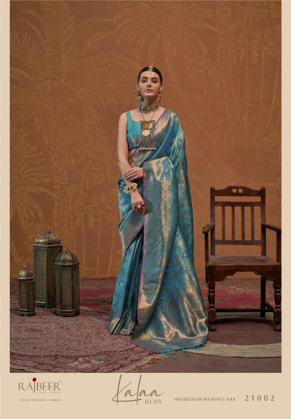 Image of Teal Pure Banarasi Silk Rich All Over Zari Weaved Saree With Tassels On Pallu