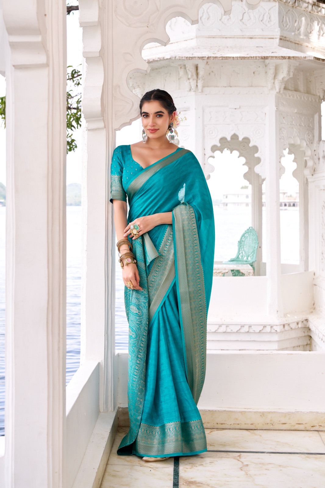 Teal Chinon Self Printed Zari Weaved Border Saree