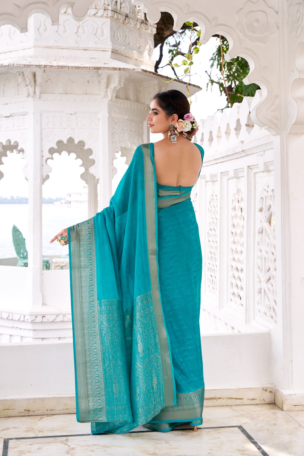 Teal Chinon Self Printed Zari Weaved Border Saree