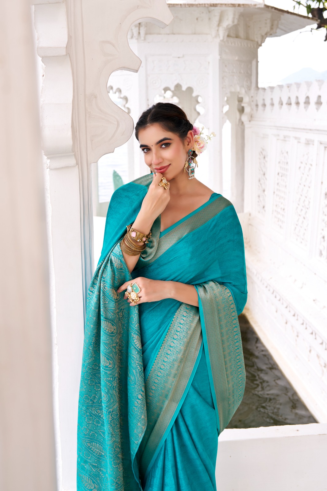 Teal Chinon Self Printed Zari Weaved Border Saree