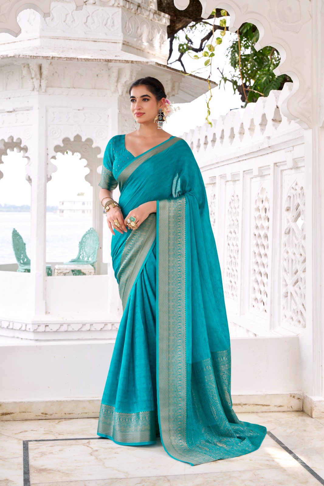 Teal Chinon Self Printed Zari Weaved Border Saree