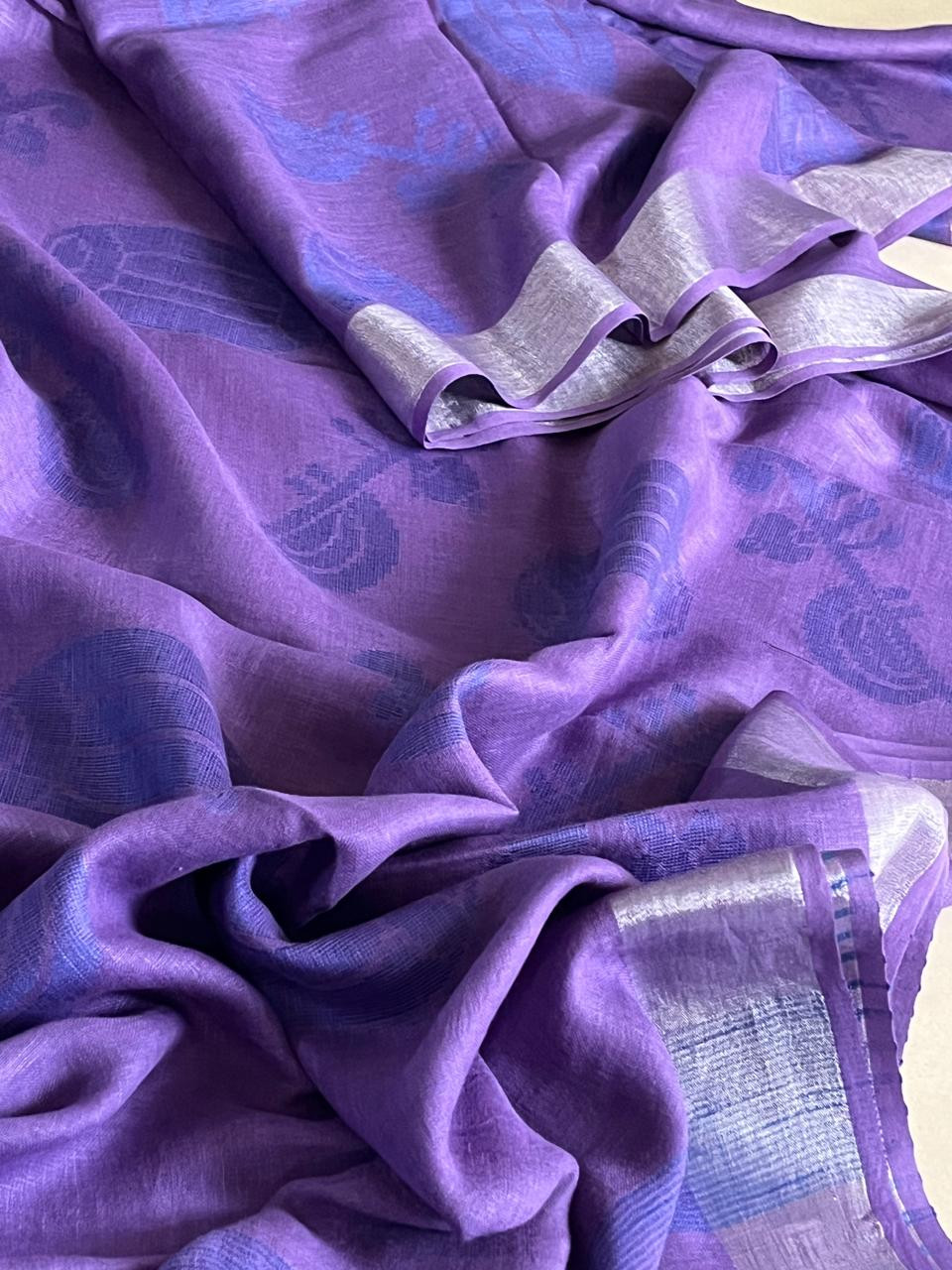 Beautiful handwoven Linen Saree with musical instruments - Purple