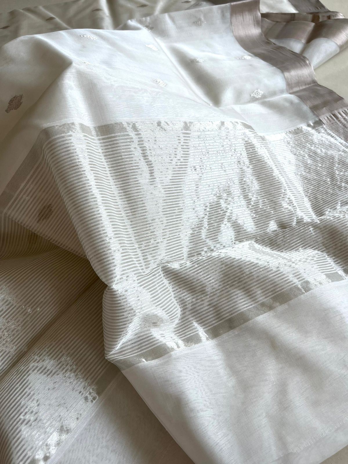 Pure Chanderi Silk Handwoven saree with buttis - White with Silver
