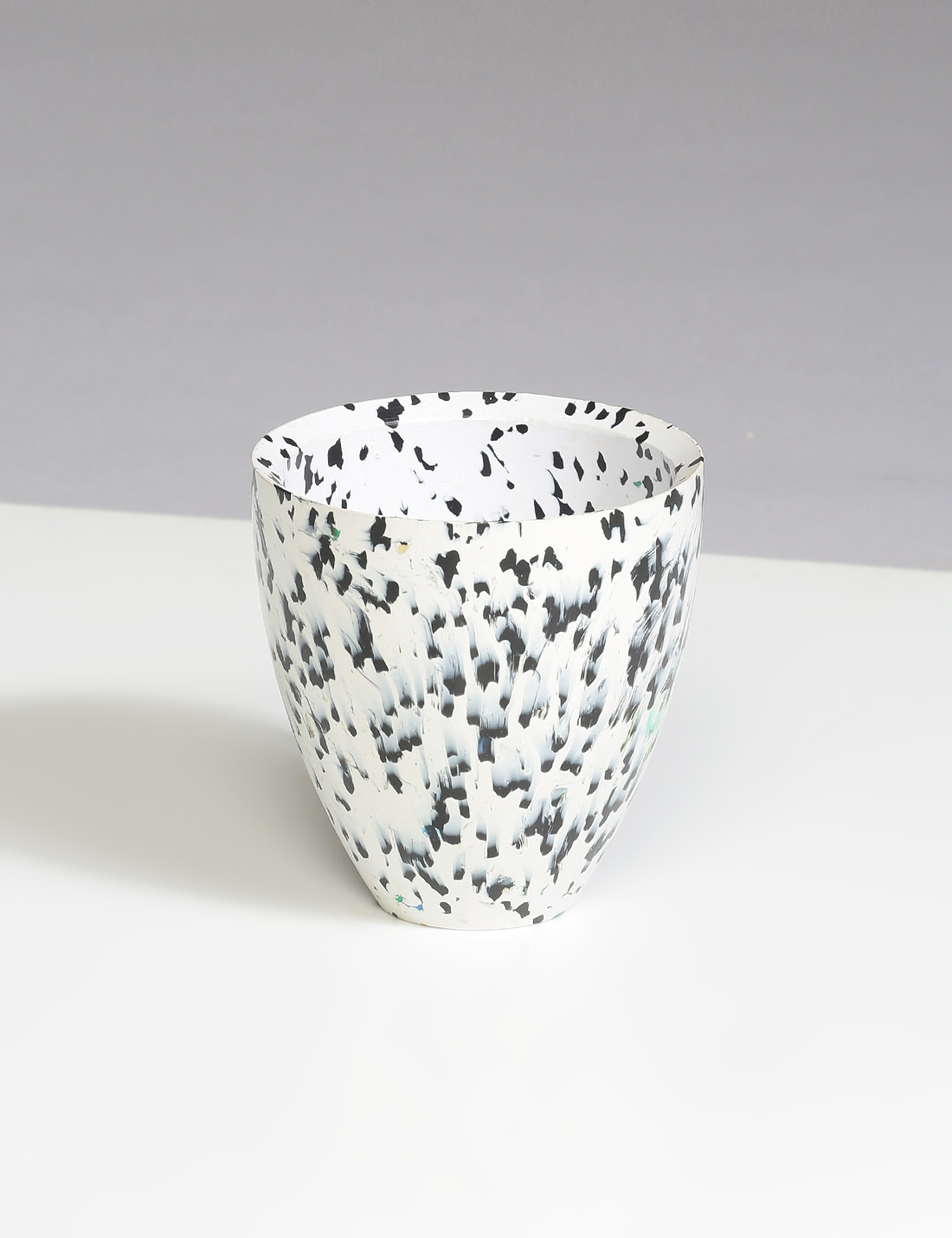 White recycled plastic planter with black spots