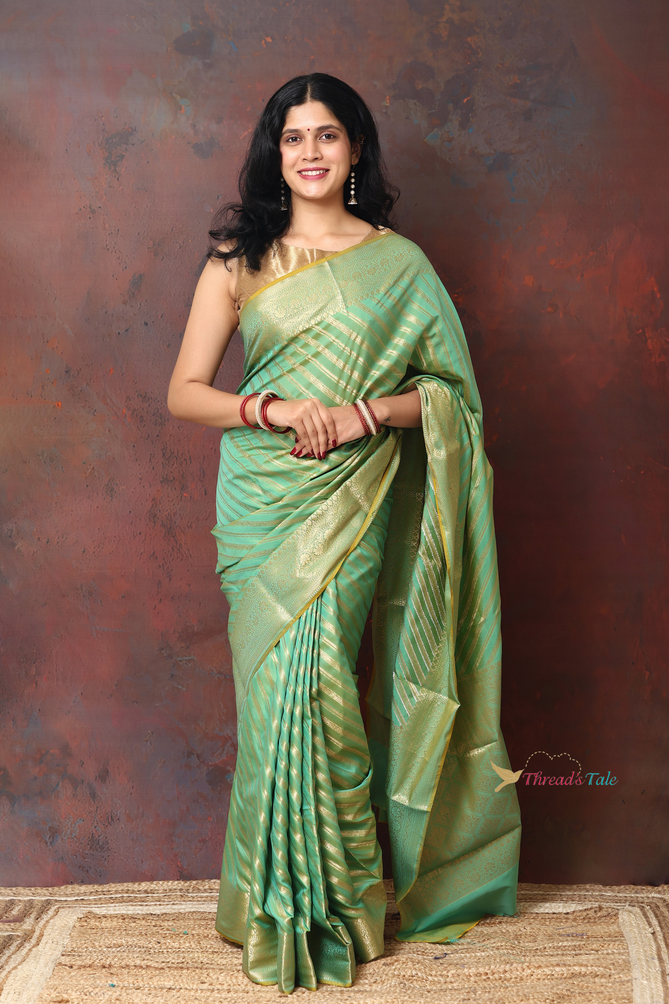 Pastel Green Saree With Woven Golden Stripes