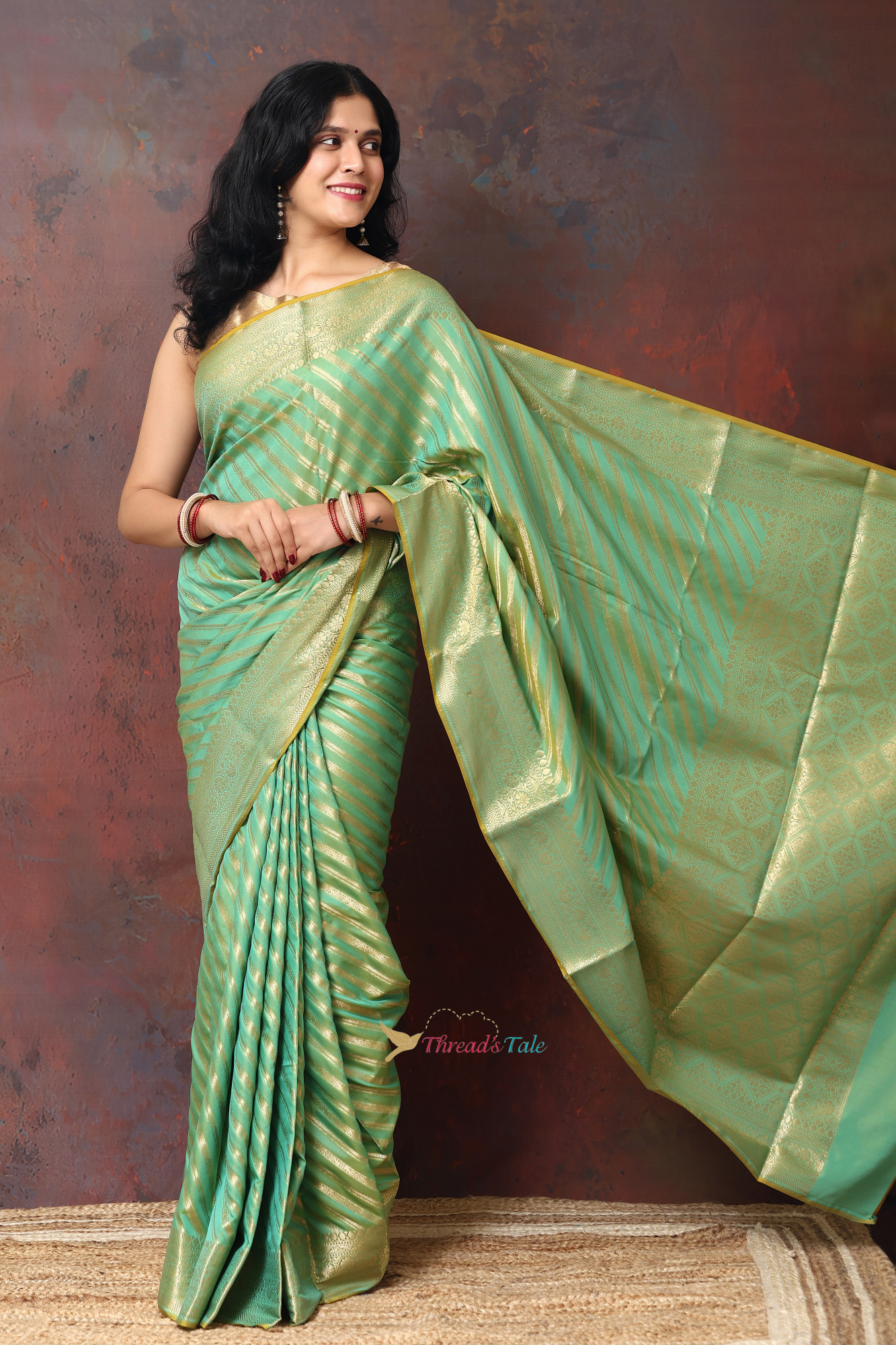 Pastel Green Saree With Woven Golden Stripes