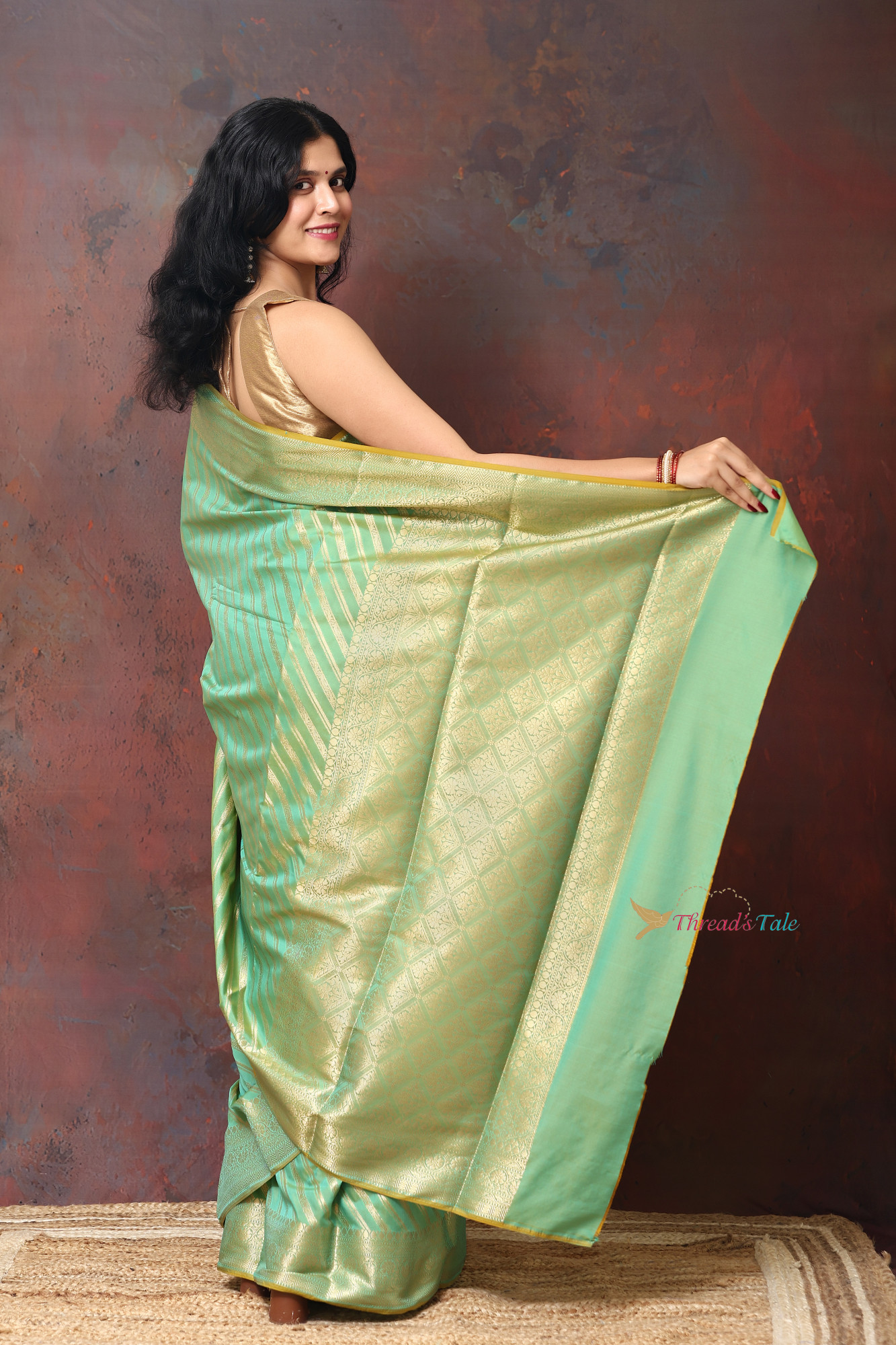 Pastel Green Saree With Woven Golden Stripes