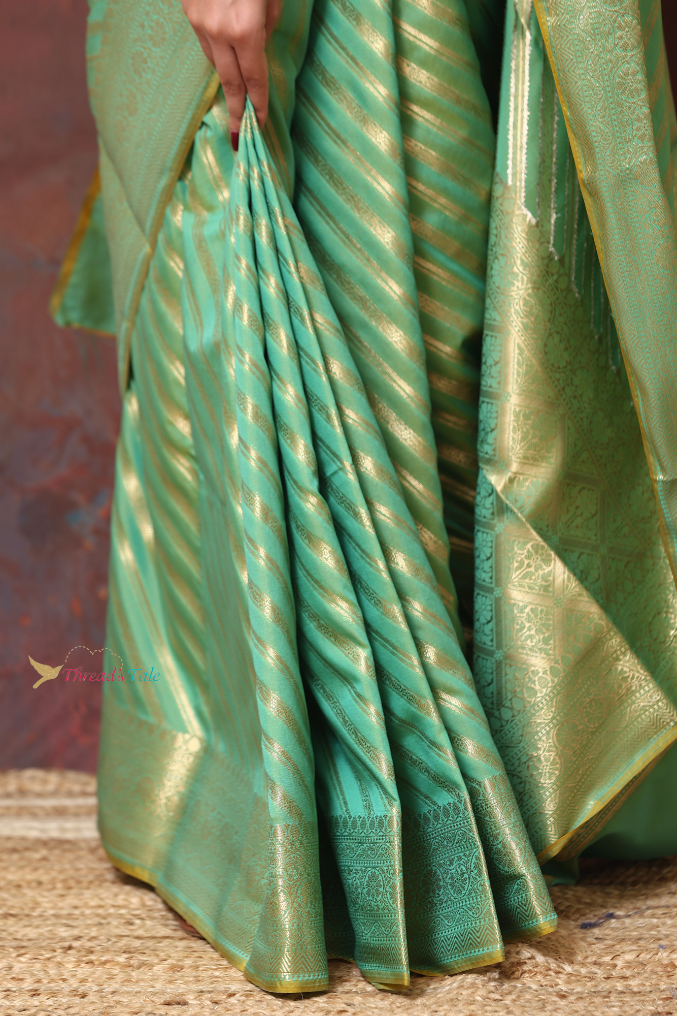 Pastel Green Saree With Woven Golden Stripes