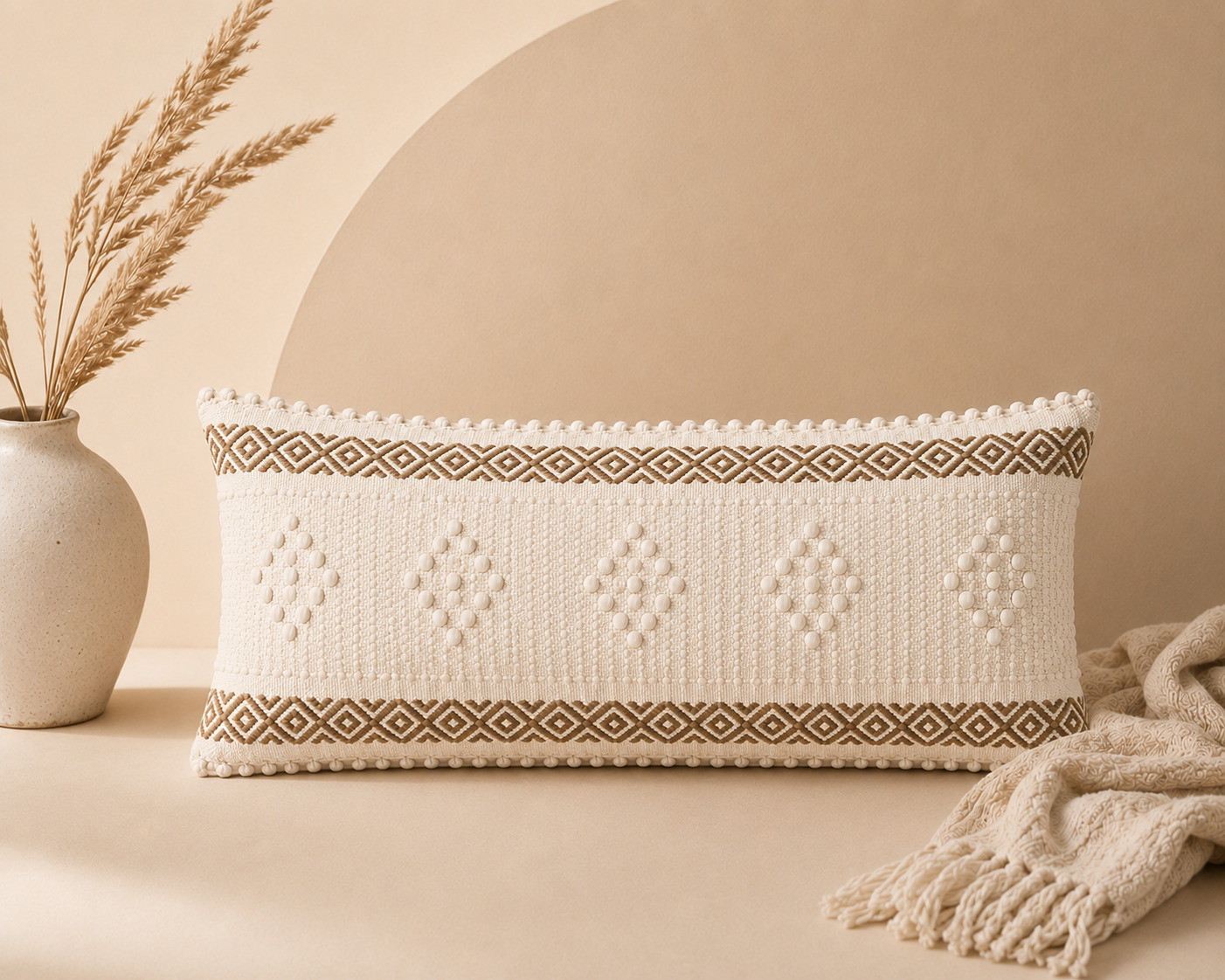 Boho diamond dot lumbar cushion cover styled with pampas grass and throw
