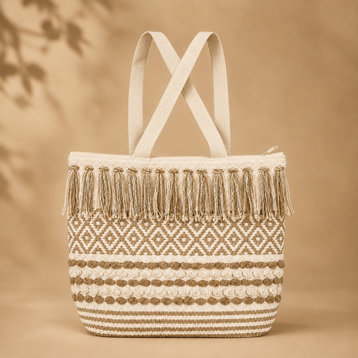 Boho woven diamond fringe tote bag with tan tassels on ivory base