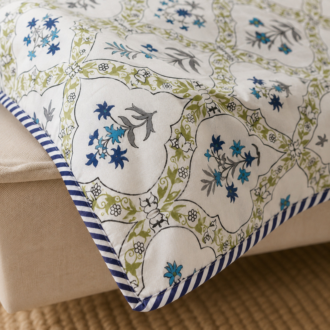 Close-up of hand block printed blue trellis dohar showing striped piping border