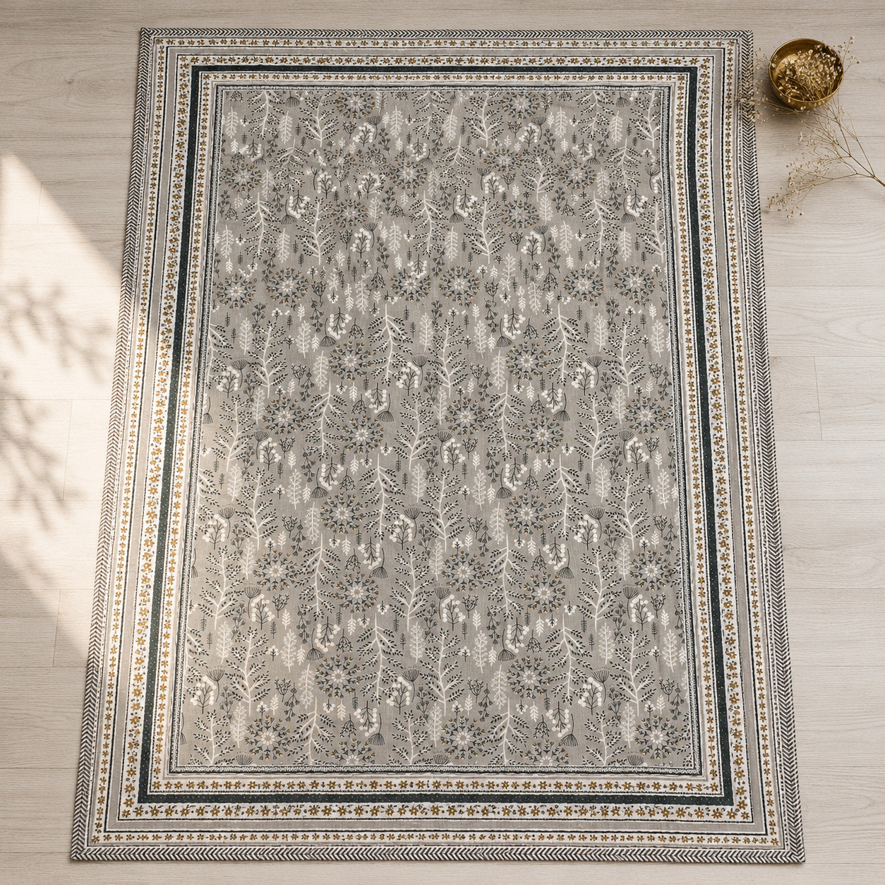 Flat lay top view of slate botanical hand block printed cotton dohar showing full forest print with ornate border