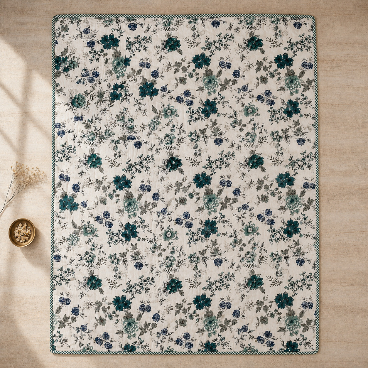 Flat lay top view of teal botanical cotton dohar showing full floral bouquet print with striped border