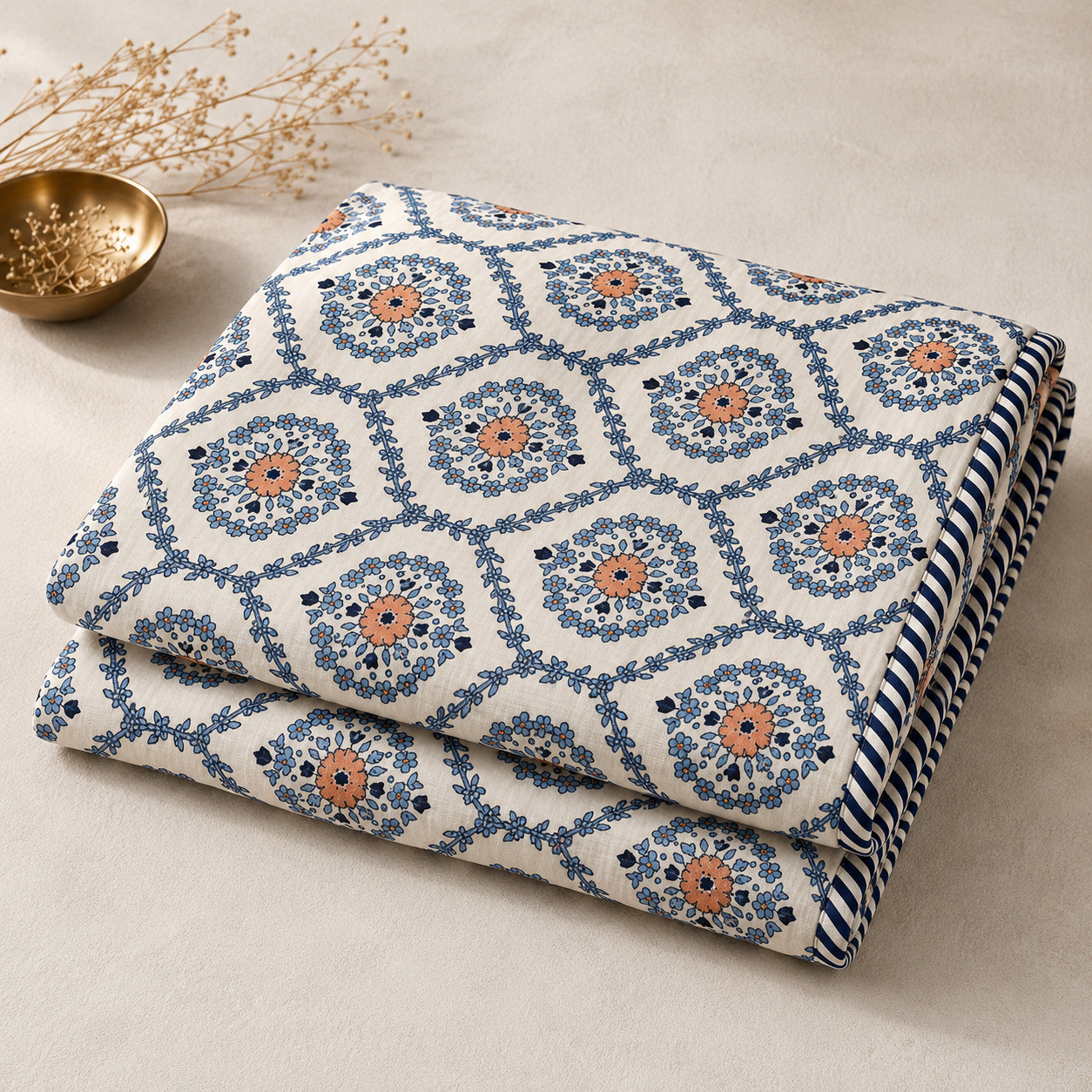 Folded set of 2 indigo medallion hand block printed cotton dohars showing striped side border