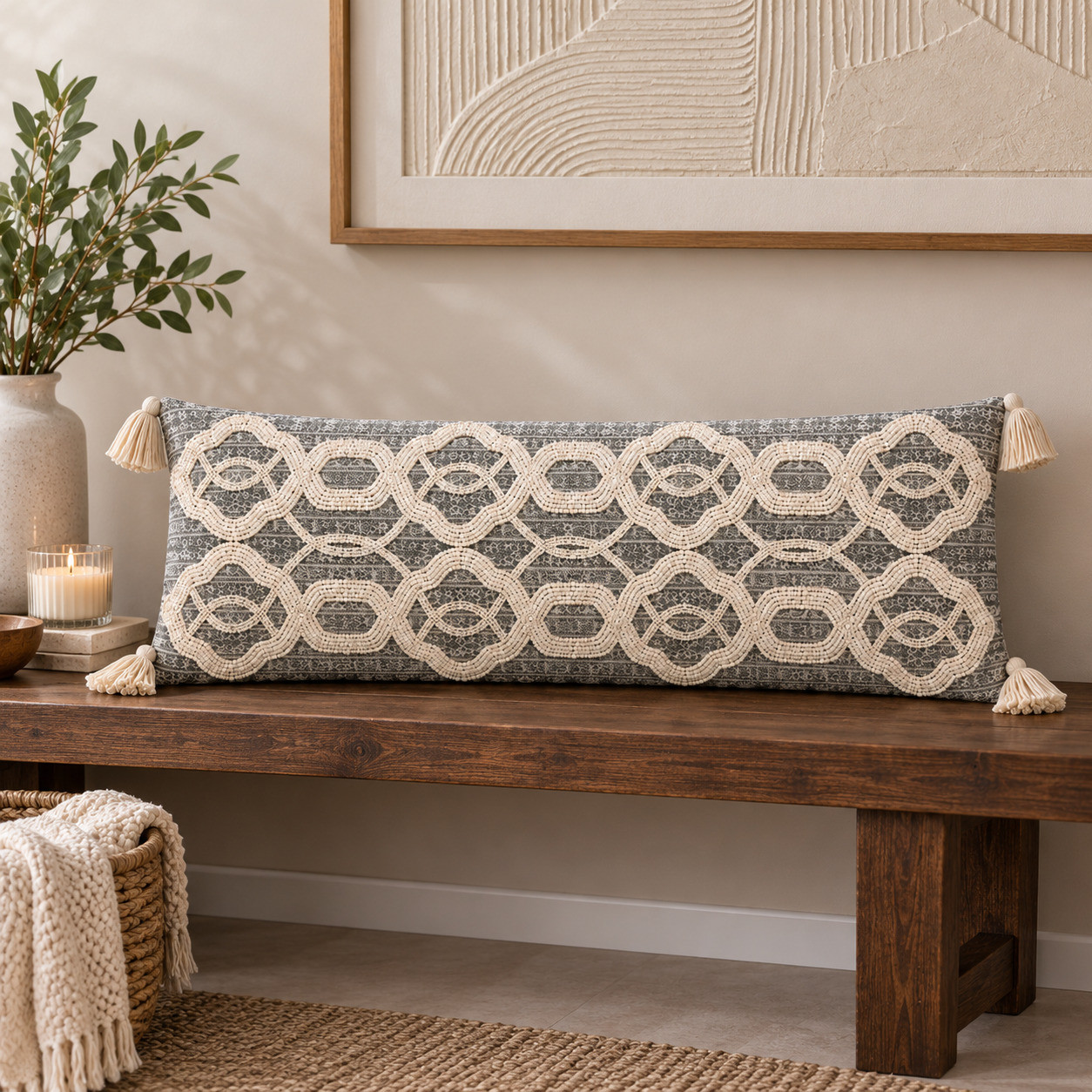 Gray beaded lumbar cushion cover displayed on wooden console bench