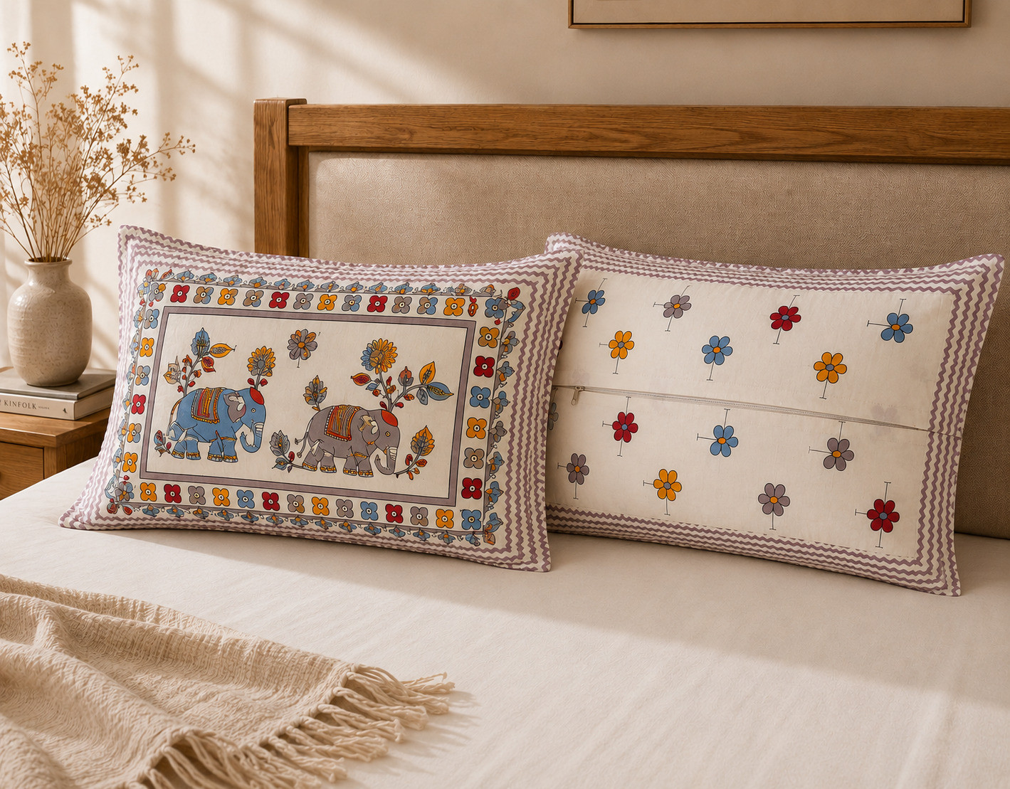 Pillow cover front with elephant pair and floral motif next to back with mini floral scatter and zipper