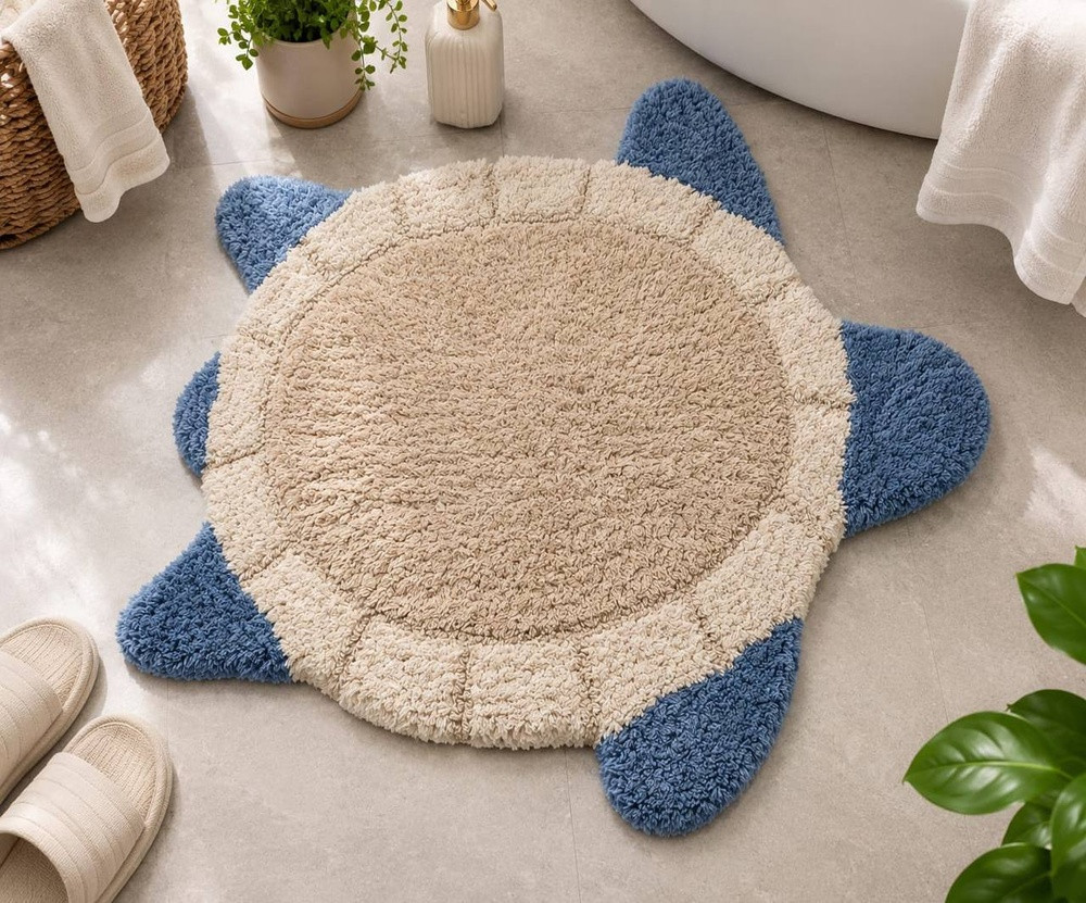 Blue and beige turtle shaped cotton bath mat with soft tufted texture for kids bathroom and nursery decor