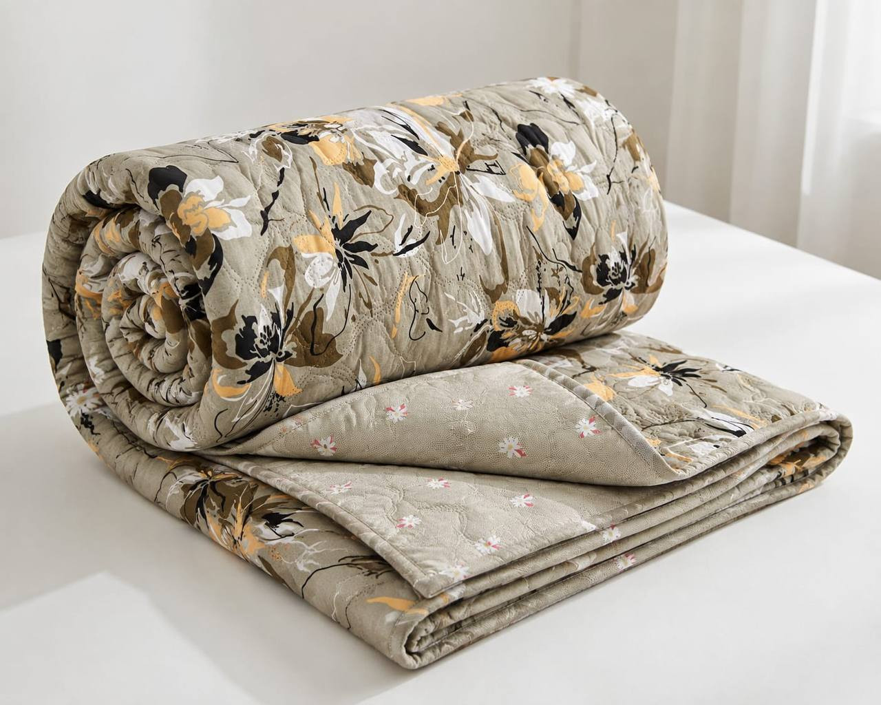 Rolled cotton quilted comforter in beige floral print showing reversible floral lining double bed size 72x90